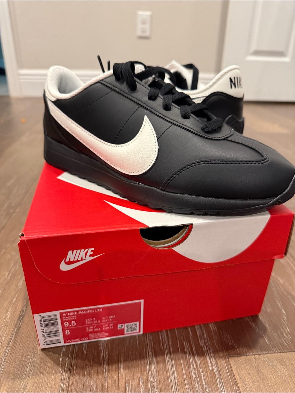 Nike Women's Black with White Swoosh Low-Top Sneakers